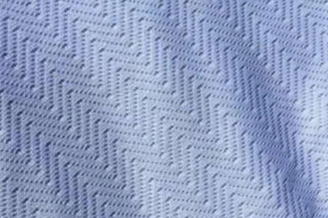 Close-up kain Drifit Milano dengan motif zig-zag
